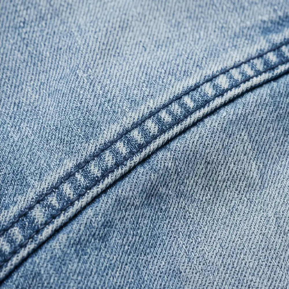 Light Blue Women's High-Waisted Cropped Barrel Leg Jeans — Lyra Light-Wash Curved-Seam - Stitching Detail Closeup