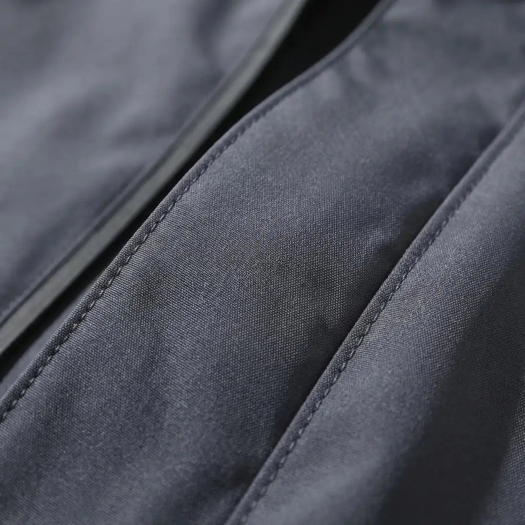 Gray Men's Hooded Waterproof Rain Jacket — Rhiannon Nylon Zip Pockets Windproof - Fabric Close Up