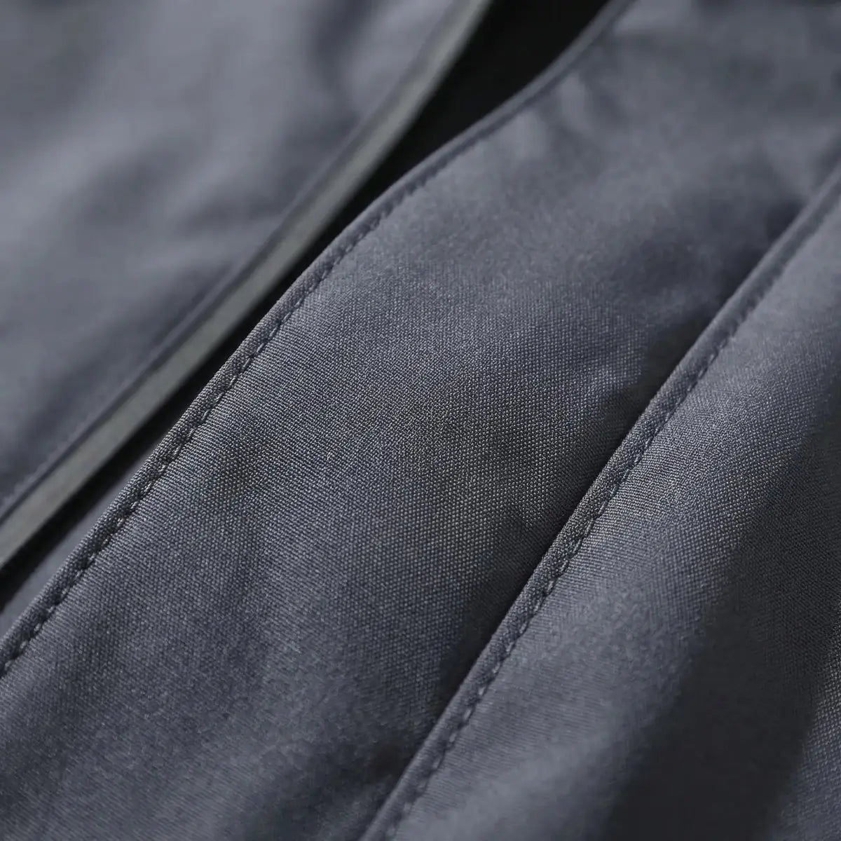 Gray Men's Hooded Waterproof Rain Jacket — Rhiannon Nylon Zip Pockets Windproof - Fabric Close Up