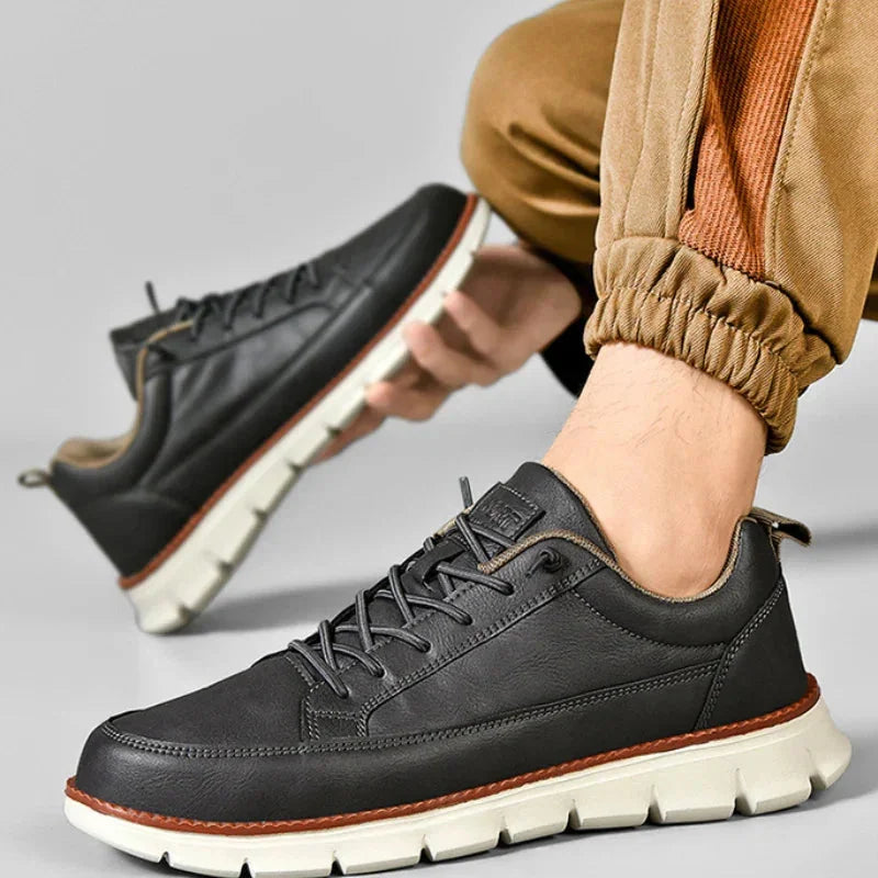 Charcoal Men's Casual Leather Sneakers — Esther Smooth-Grain Lace-Up Low-Top - Worn Lifestyle Crouching