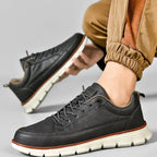 Charcoal Men's Casual Leather Sneakers — Esther Smooth-Grain Lace-Up Low-Top - Worn Lifestyle Crouching