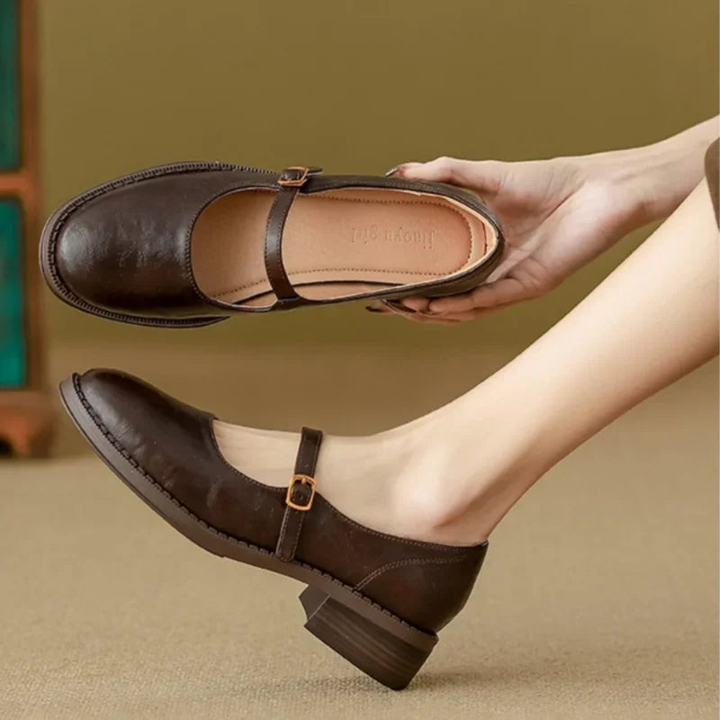 Brown Women's Leather Mary Janes — Nia Buckle-Strap Round-Toe Block Heel - Hand Hold Angle