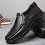 Black Men's Leather Slip-On Shoes — Edward Cushioned Moc-Toe Business Loafers - Front Angle