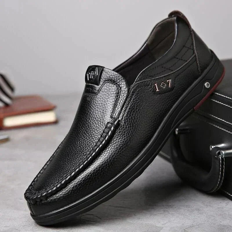 Black Men's Leather Slip-On Shoes — Edward Cushioned Moc-Toe Business Loafers - Front Angle