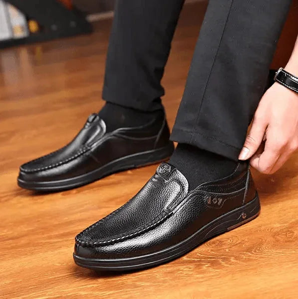 Black Men's Leather Slip-On Shoes — Edward Cushioned Moc-Toe Business Loafers - Worn Adjusting