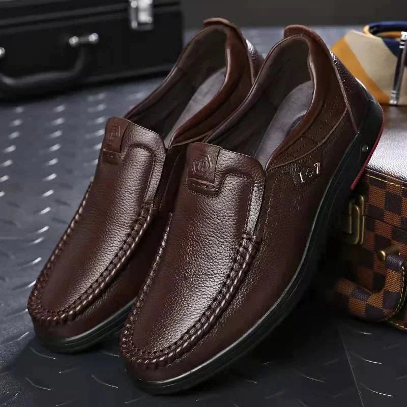 Brown Men's Leather Slip-On Shoes — Edward Cushioned Moc-Toe Business Loafers - Pair Close Up