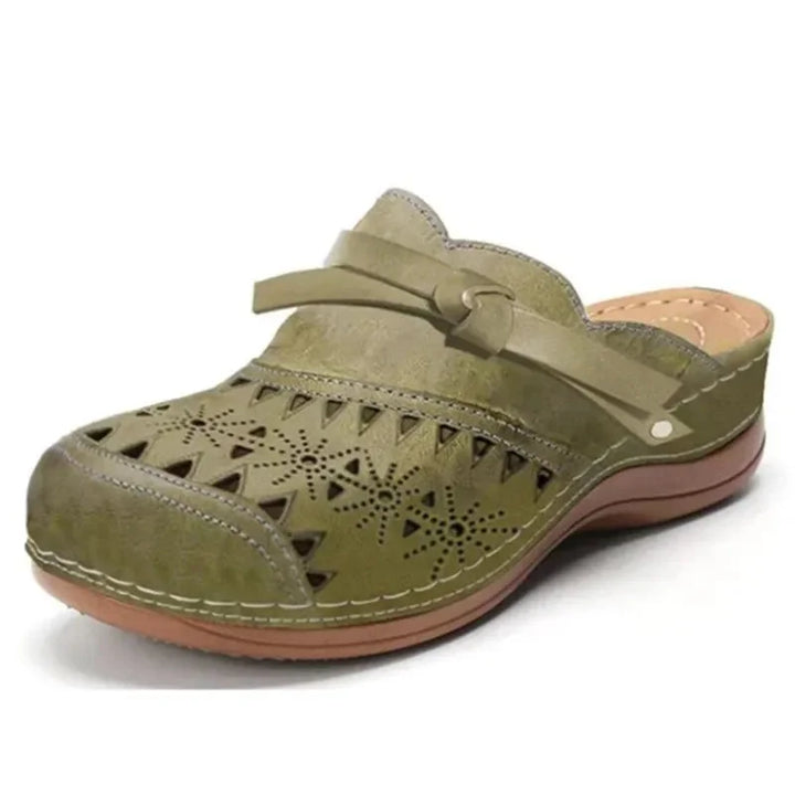 Army Women's Perforated Wedge Clogs — Indigo Cushioned Buckle-Strap Cutout - Green Front Angle