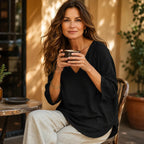 Black Women's V-Neck Linen Blouse — Mabel Relaxed Curved-Hem Three-Quarter Sleeve - Seated Lifestyle