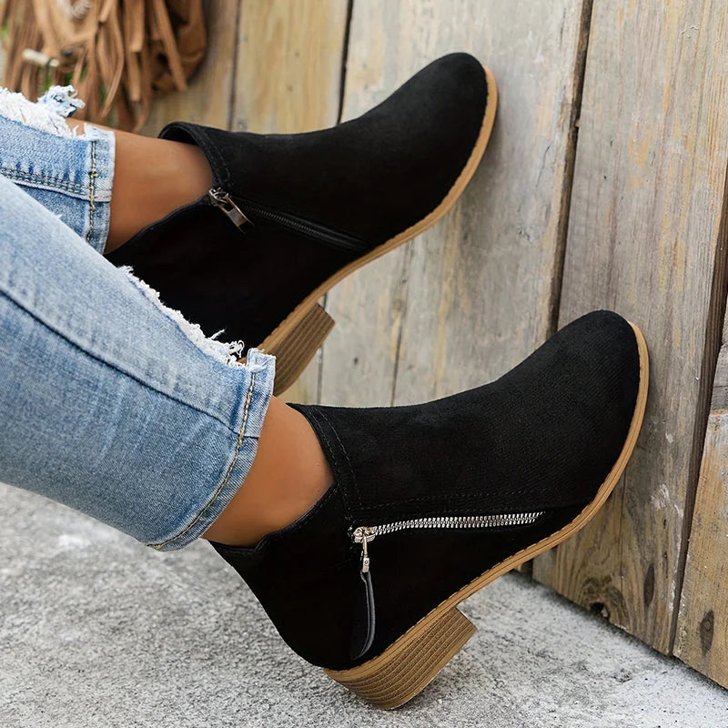 Black Women's Pointed Toe Ankle Boots — Mia Suede Zip-Up Block Heel - Leaning Wall Closeup