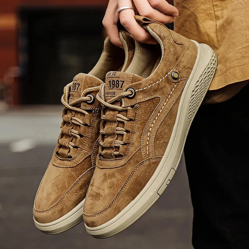 Brown Men's Casual Low-Top Sneakers — Zelda Suede Lace-Up Cushioned - Hand Holding Pair