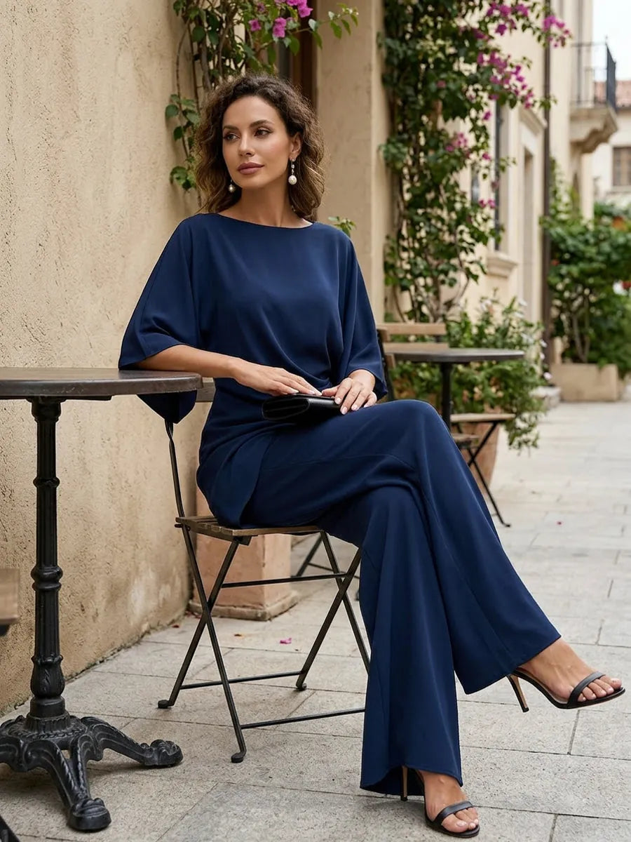 Navy Blue Women's Wide-Leg Two Piece Set — Simone Asymmetric Hem Batwing Sleeve - Seated Side Pose